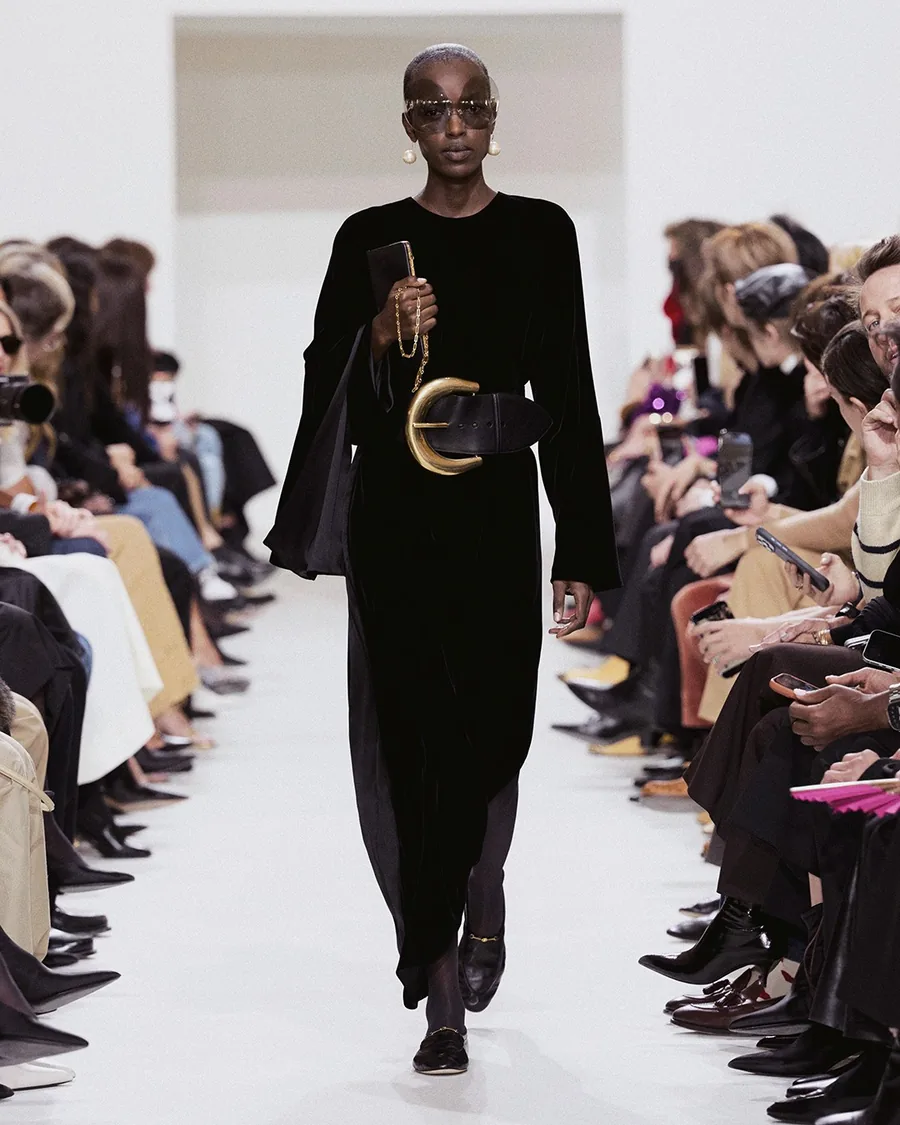 Celine Spring-Summer 2027 black look with a wide belt and a pearl necklace on the runway
