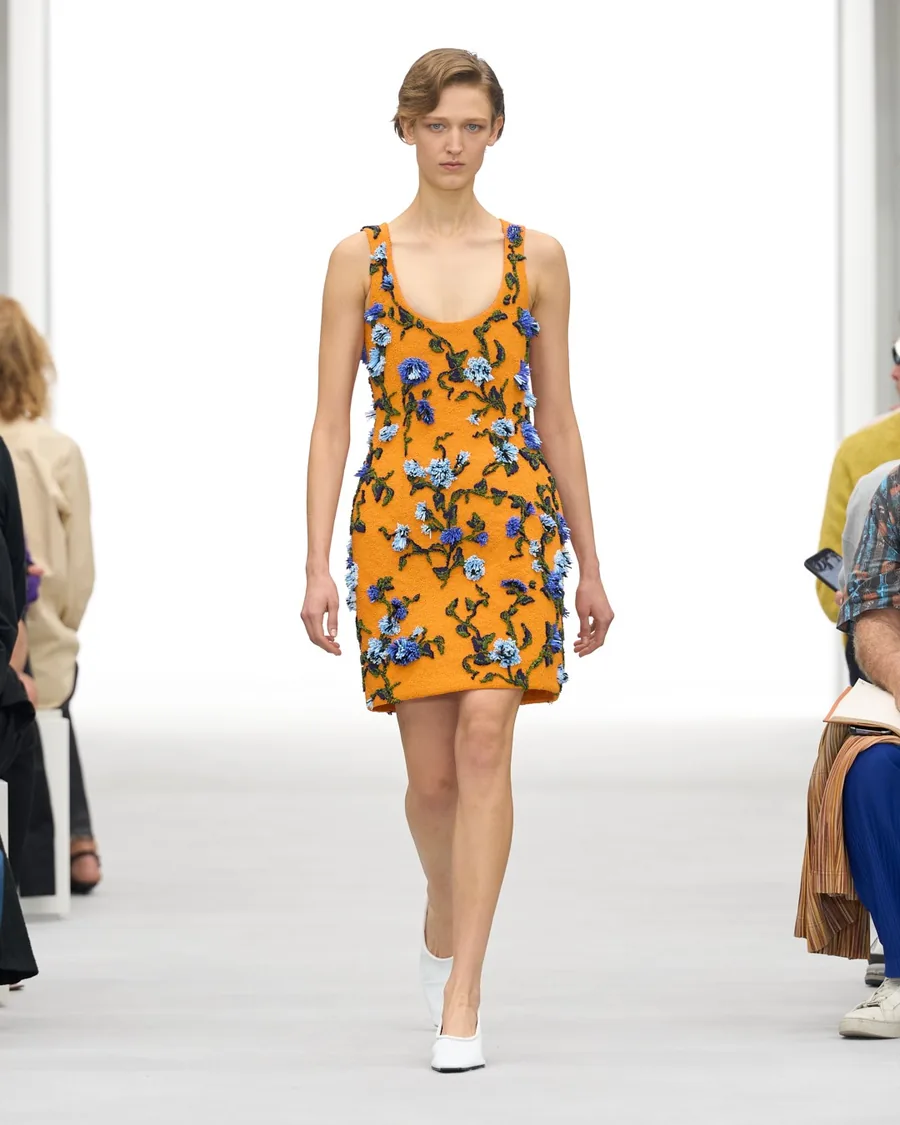 Loewe Spring-Summer 2027 look: orange dress with blue flowers on the runway
