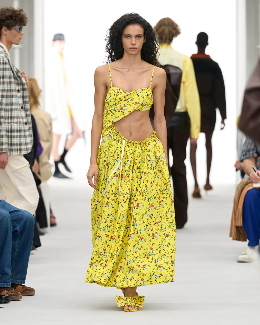 Loewe Spring-Summer 2027 look: yellow floral dress with an open waist on the runway
