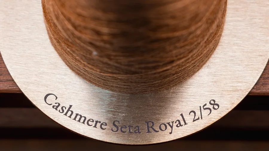 Loro Piana yarn cone on a brass plate engraved Cashmere Seta Royal 2/58