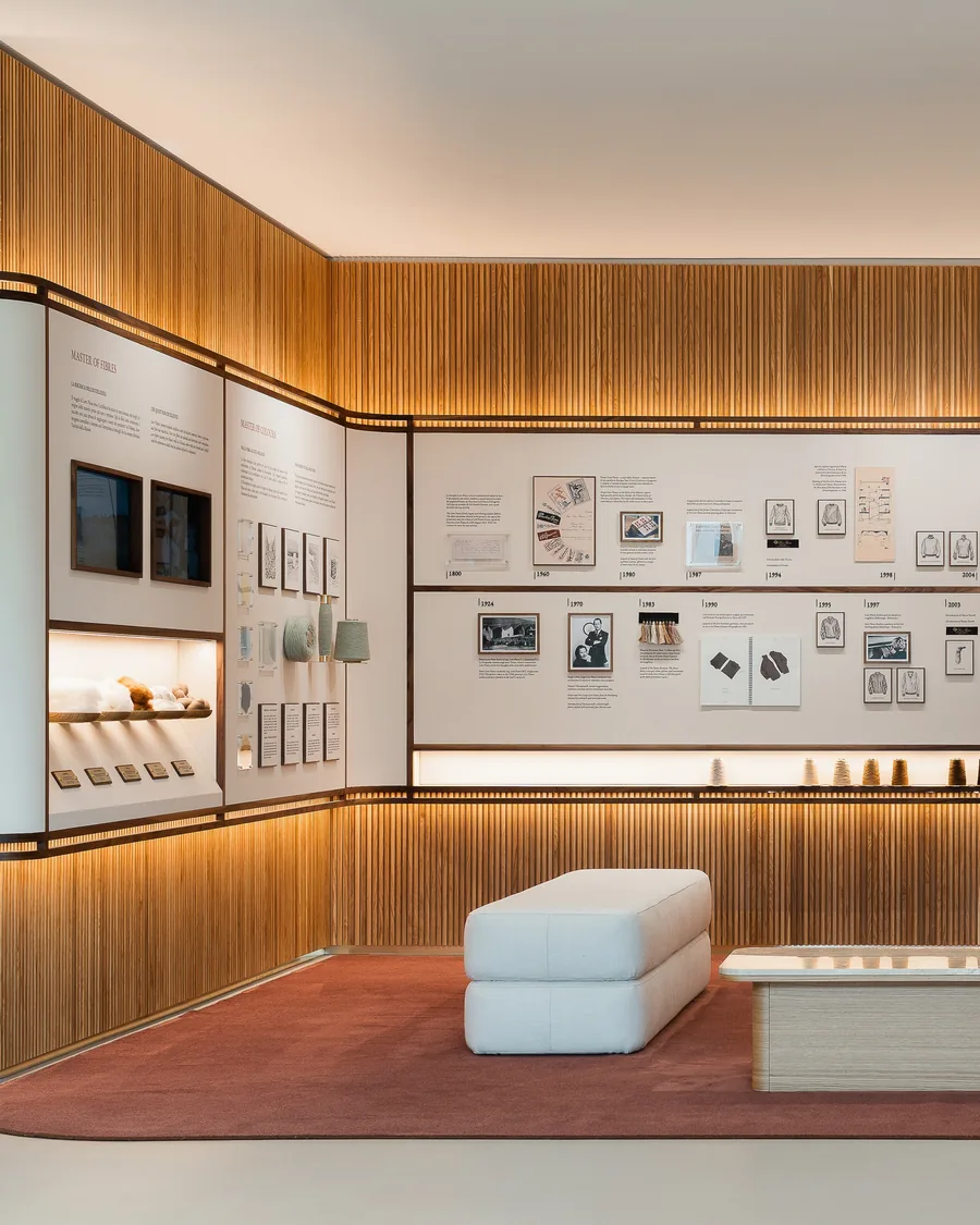 Educational space in the Loro Piana manufacture in Ghemme, with wood panelled walls and displays on the history of the house